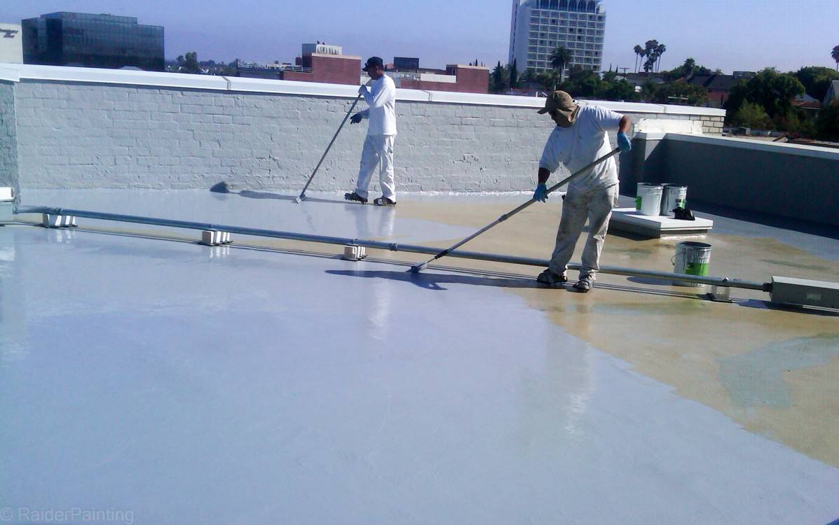 Contractor Waterproofing a Commercial Building Roof